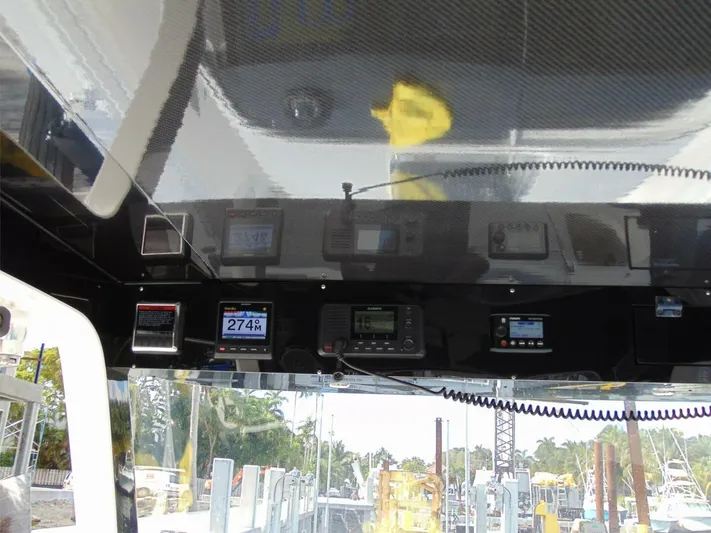  Yacht Photos Pics 2016 Edgewater 368 CC dashboard with navigation and communication equipment.