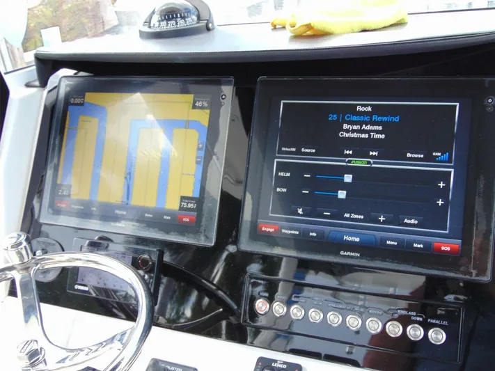  Yacht Photos Pics Dashboard of a 2016 Edgewater 368 CC boat with navigation and audio displays.