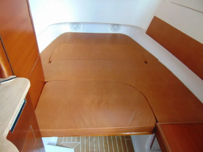  Yacht Photos Pics 2016 Edgewater 368 CC cabin interior with wooden finish and cushioned seating.