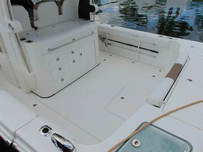  Yacht Photos Pics 2016 Edgewater 368 CC boat deck with storage compartments and seating.