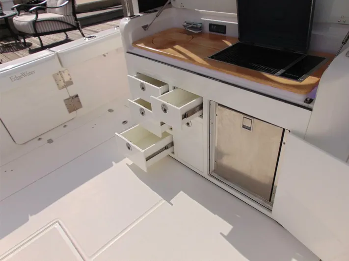  Yacht Photos Pics Edgewater 368 CC 2016 boat interior with open storage drawers and cabinets.