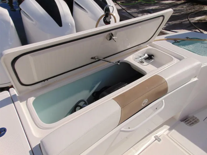  Yacht Photos Pics Open storage compartment on 2016 Edgewater 368 CC boat, featuring white and beige seating.