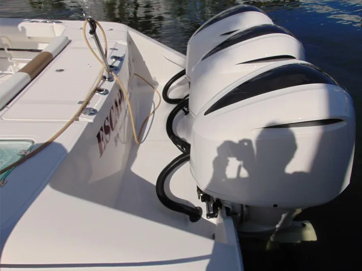  Yacht Photos Pics 2016 Edgewater 368 CC boat with triple outboard engines on water.