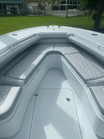 Lauren J Yacht Photos Pics 2022 Yellowfin 32 boat interior with cushioned seating and sleek design.