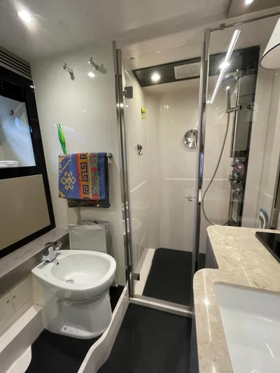  Yacht Photos Pics Luxurious bathroom in 2019 Azimut Magellano 66 yacht with modern shower and fixtures.