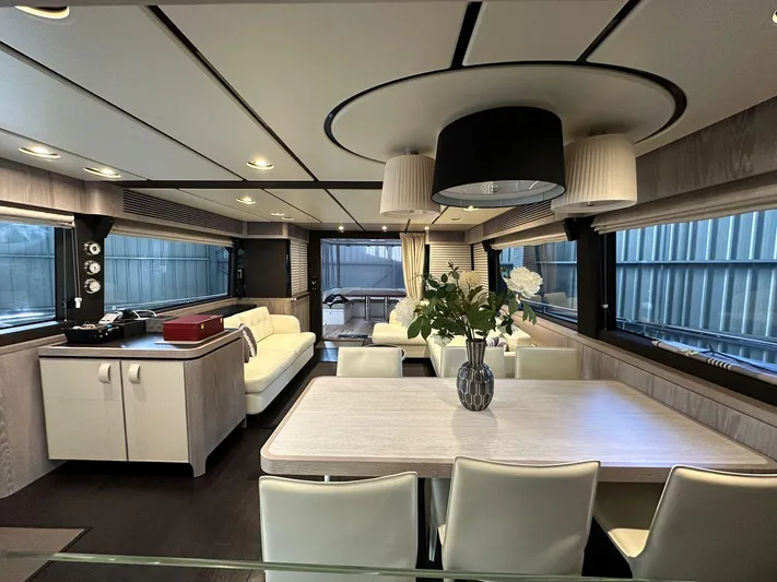  Yacht Photos Pics Luxurious interior of 2019 Azimut Magellano 66 yacht with modern dining area and elegant decor.