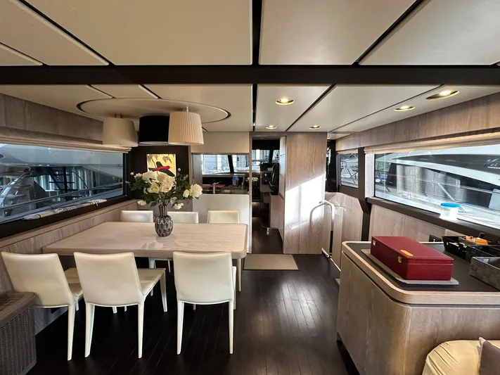  Yacht Photos Pics Luxurious interior of 2019 Azimut Magellano 66 yacht with elegant dining area and modern decor.