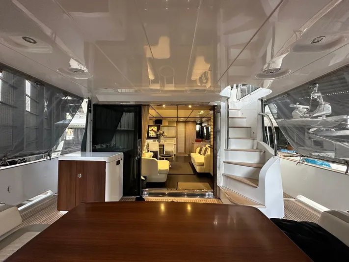  Yacht Photos Pics Luxurious interior of 2019 Azimut Magellano 66 yacht with elegant seating and staircase.