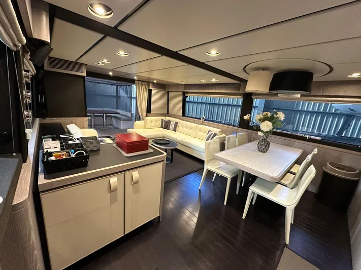  Yacht Photos Pics Luxurious interior of 2019 Azimut Magellano 66 yacht with modern kitchen and dining area.