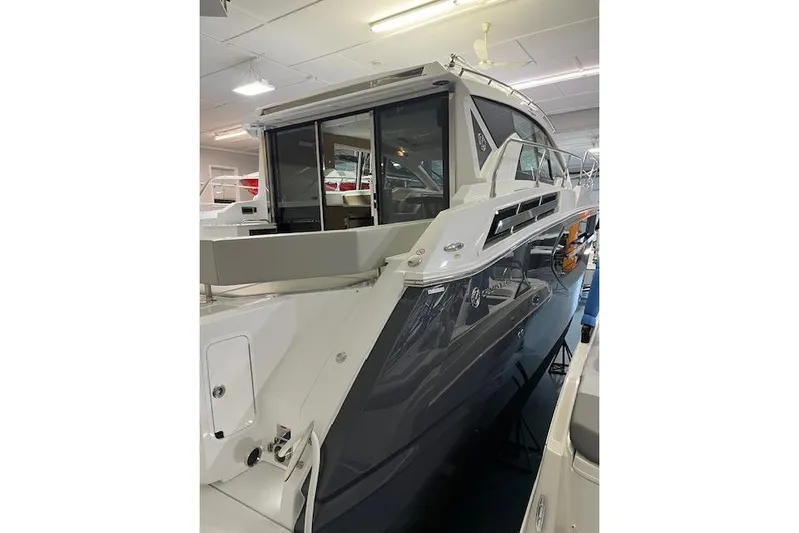  Yacht Photos Pics 2026 Cruisers Yachts 42 Cantius in showroom, sleek design, modern features.