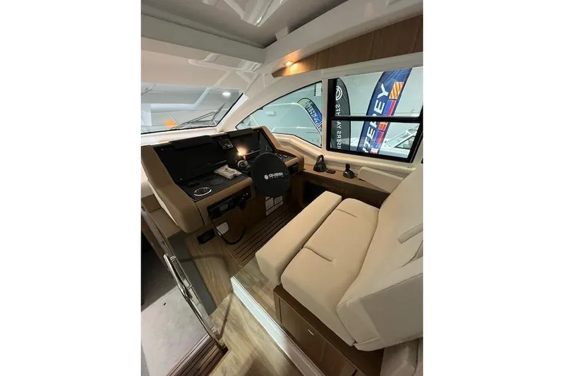  Yacht Photos Pics Interior of 2026 Cruisers Yachts 42 Cantius, featuring modern helm and seating.
