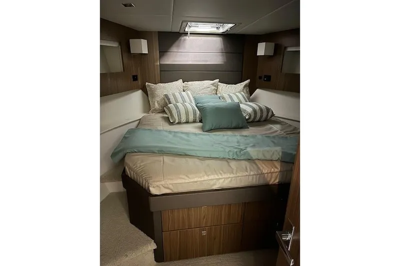  Yacht Photos Pics Luxurious bedroom interior of 2026 Cruisers Yachts 42 Cantius with elegant bedding.