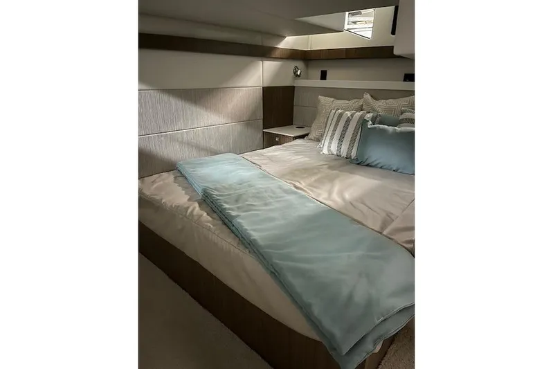  Yacht Photos Pics Luxurious bedroom interior of 2026 Cruisers Yachts 42 Cantius with elegant bedding.