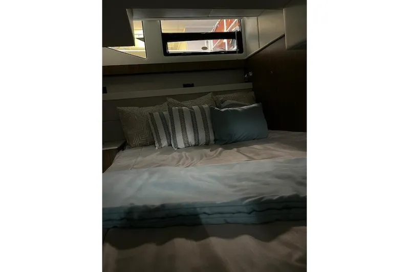  Yacht Photos Pics Luxurious bedroom interior of 2026 Cruisers Yachts 42 Cantius with elegant bedding.