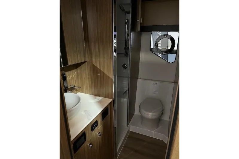  Yacht Photos Pics Luxurious bathroom in 2026 Cruisers Yachts 42 Cantius, featuring modern fixtures and wood accents.