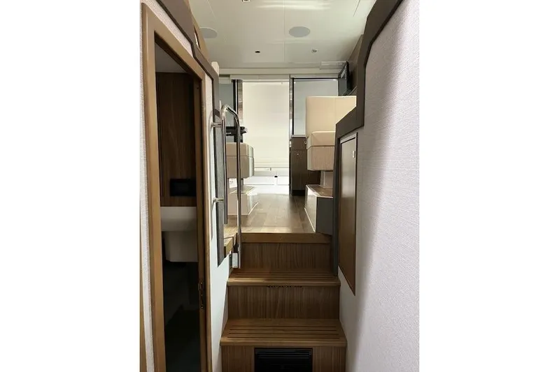  Yacht Photos Pics Interior view of 2026 Cruisers Yachts 42 Cantius, featuring modern wooden stairs and sleek design.