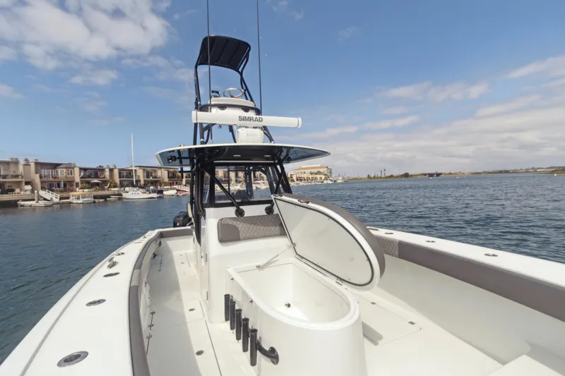 Bangarang Yacht Photos Pics 2022 Freeman 34VH boat on water, open hatch, clear sky, coastal background.