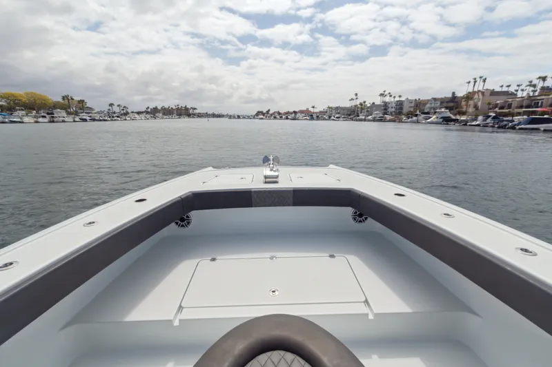 Bangarang Yacht Photos Pics Bow view of 2022 Freeman 34VH boat on a calm waterway.