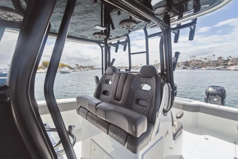 Bangarang Yacht Photos Pics Luxurious interior of 2022 Freeman 34VH boat with plush seating and scenic water view.