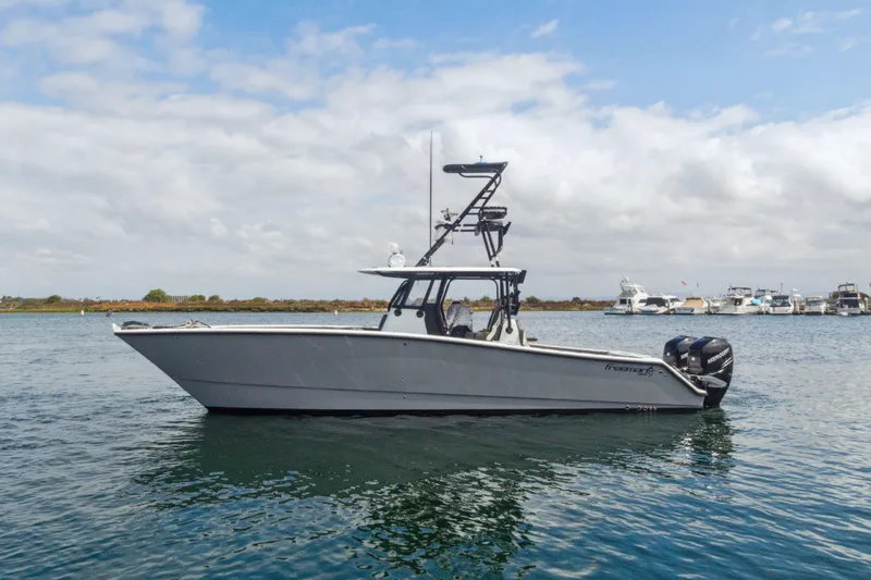 Bangarang Yacht Photos Pics 2022 Freeman 34VH boat on calm water under a partly cloudy sky.