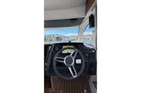2024 Nimbus 305 Coupe helm with navigation display and steering wheel.