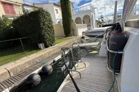 2024 Nimbus 305 Coupe docked, showcasing sleek design and modern amenities.