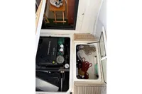 Engine compartment of 2024 Nimbus 305 Coupe with Volvo Penta D4-270 engine and storage area.