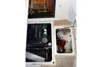 Engine compartment of 2024 Nimbus 305 Coupe with Volvo Penta D4-270 engine and storage area.