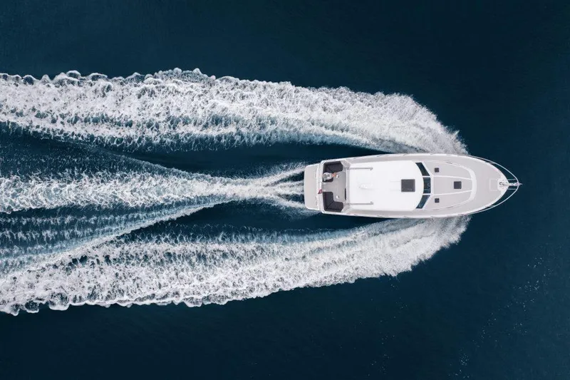 Call For Availability Yacht Photos Pics Aerial view of 2027 Back Cove 372 yacht on open water.