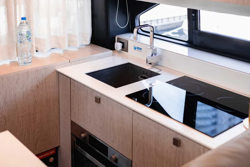  Yacht Photos Pics Modern kitchen in 2019 Cranchi E 52F yacht with sleek design and appliances.