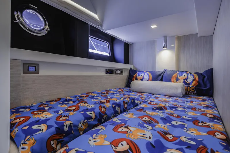  Yacht Photos Pics Cranchi E 52F 2019 yacht cabin with Sonic-themed bedding and modern lighting.