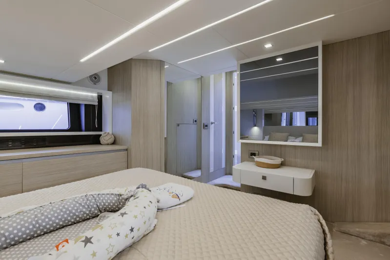  Yacht Photos Pics Luxurious interior of 2019 Cranchi E 52F yacht bedroom with modern design.