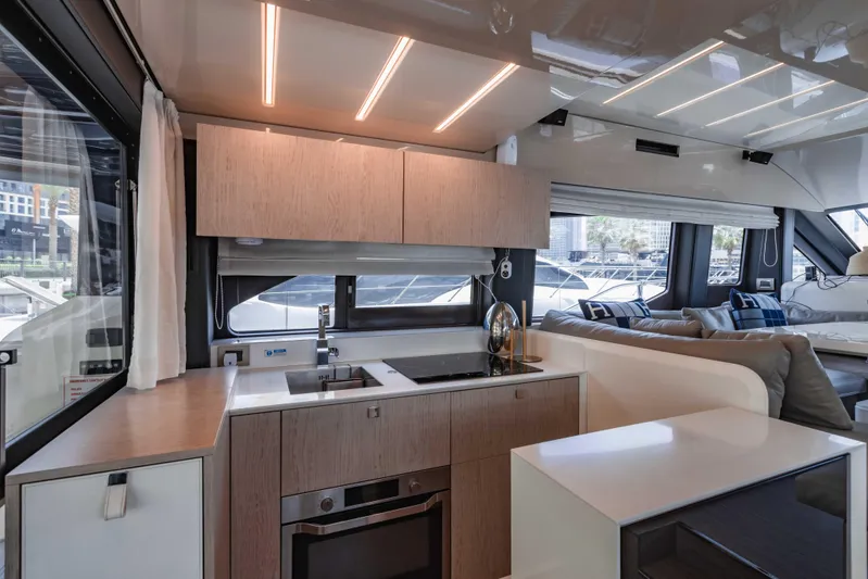  Yacht Photos Pics Luxurious interior of 2019 Cranchi E 52F yacht with modern kitchen and seating area.