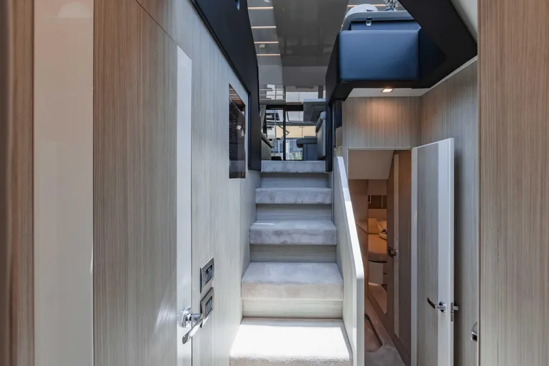  Yacht Photos Pics Interior of 2019 Cranchi E 52F yacht, featuring modern staircase and sleek design.