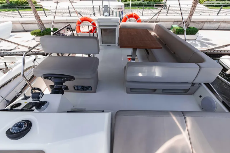  Yacht Photos Pics 2019 Cranchi E 52F yacht interior with seating and navigation area.