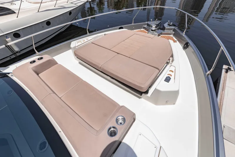  Yacht Photos Pics 2019 Cranchi E 52F yacht with spacious sunbathing area and luxurious seating.