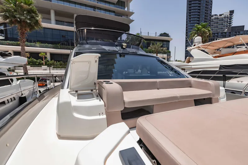  Yacht Photos Pics 2019 Cranchi E 52F yacht with modern design, docked in a marina setting.