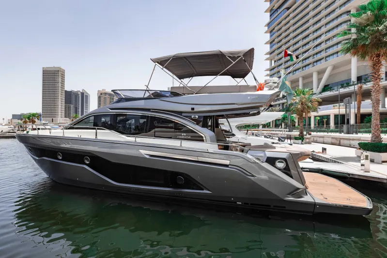  Yacht Photos Pics 2019 Cranchi E 52F yacht docked in a modern marina setting.