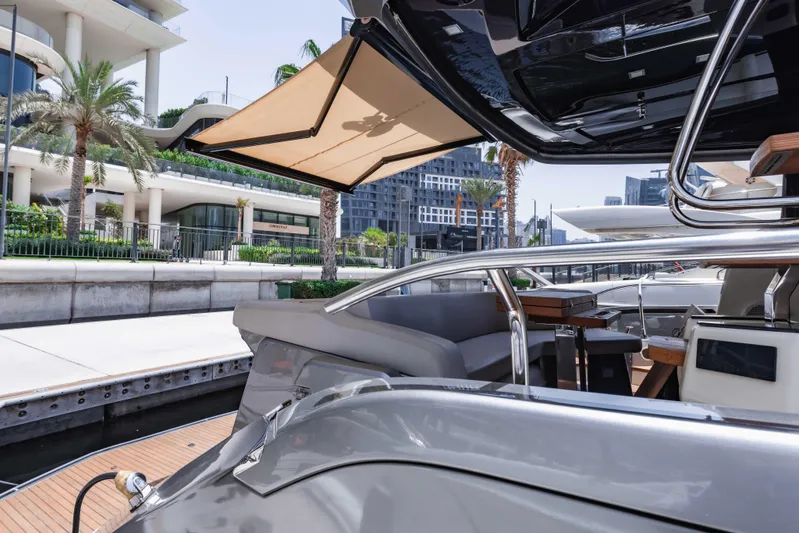  Yacht Photos Pics 2019 Cranchi E 52F yacht docked, featuring sleek design and luxurious seating area.