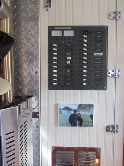 Silverado Yacht Photos Pics Electrical panel on 2009 Custom Pilothouse Cutter with photo and metal accents.