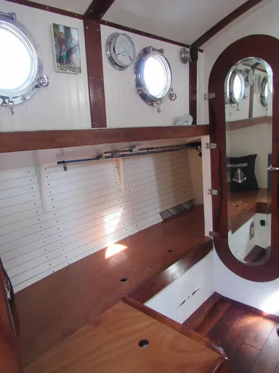 Silverado Yacht Photos Pics Interior of 2009 Custom Pilothouse Cutter with wooden finishes and portholes.