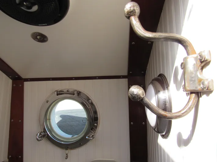 Silverado Yacht Photos Pics Interior of 2009 Custom Pilothouse Cutter with porthole and brass hook.