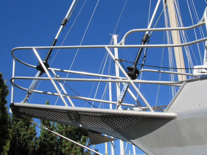 Silverado Yacht Photos Pics Custom Pilothouse Cutter 2009 bow with metal railings against clear blue sky.