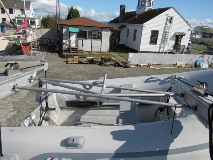 Silverado Yacht Photos Pics 2009 Custom Pilothouse Cutter with dinghy on deck, dockside view.