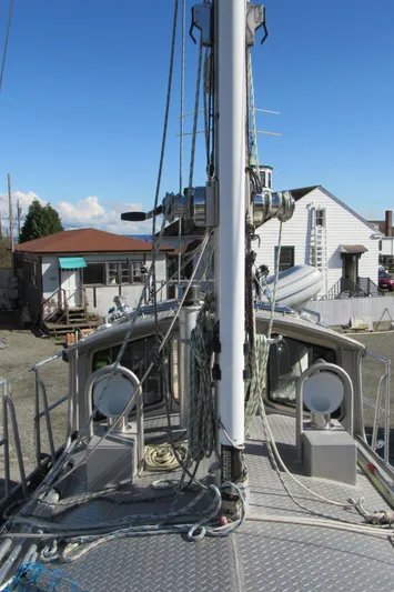 Silverado Yacht Photos Pics 2009 Custom Pilothouse Cutter sailboat docked, showcasing mast and rigging against a clear sky.
