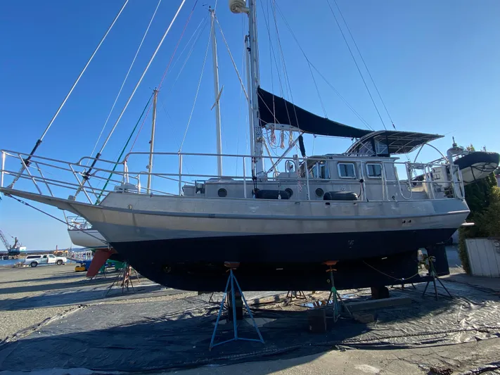 Silverado Yacht Photos Pics 2009 Custom Pilothouse Cutter sailboat on stands, displayed outdoors under clear blue sky.