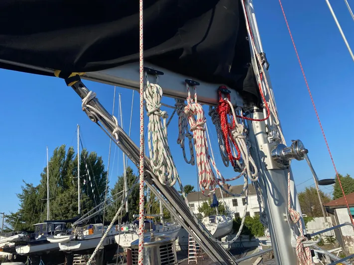 Silverado Yacht Photos Pics Sailboat rigging on a 2009 Custom Pilothouse Cutter, with ropes and mast against a clear sky.