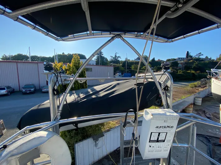 Silverado Yacht Photos Pics 2009 Custom Pilothouse Cutter with covered deck, docked in a marina under clear skies.