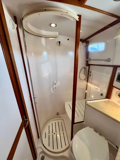 Serendipity II Yacht Photos Pics Bathroom interior of 2010 Sabre 40 Sedan yacht with shower and toilet.
