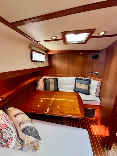 Serendipity II Yacht Photos Pics Cozy interior of 2010 Sabre 40 Sedan with elegant wood finish and plush seating.